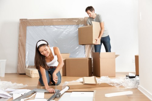 Professional house movers in Crawley loading furniture into a truck