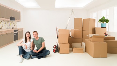 Professional movers handling and securing furniture