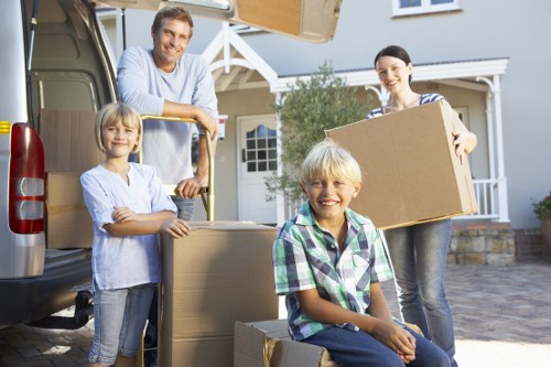 Professional movers handling household items in Oakleigh Park