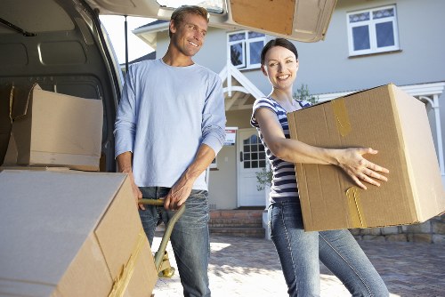 Movers packing items carefully in a Thames Ditton home